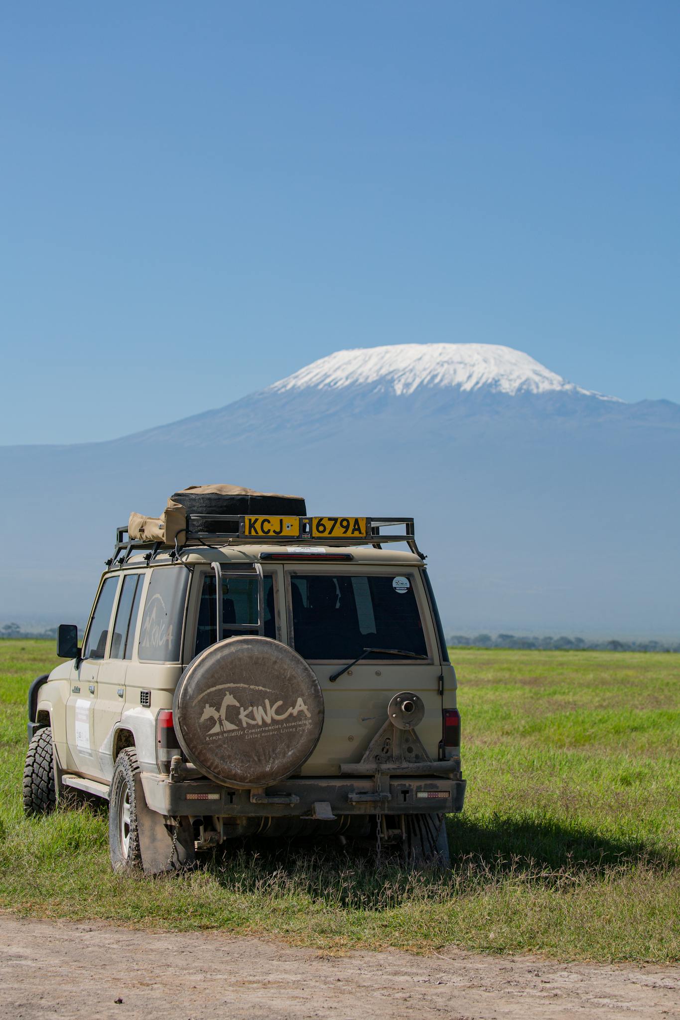 4x4 vehicle on African safari with Mount Kilimanjaro in the background.